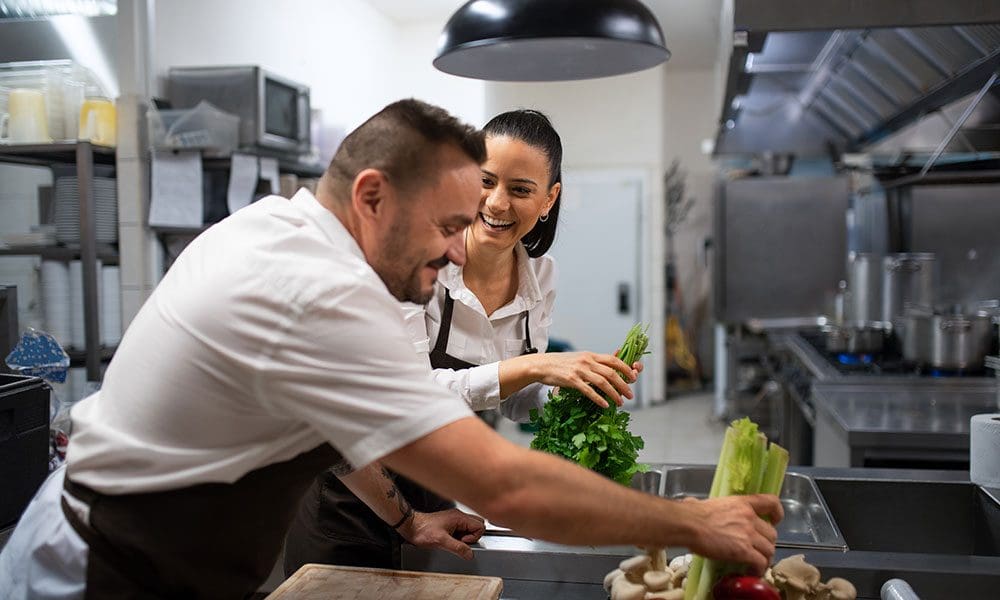 chefs-preparing-vegetables-for-cutting-in-commerc